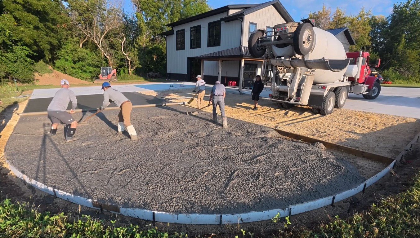 Professional concrete crew pouring driveway in Pittsfield, MA